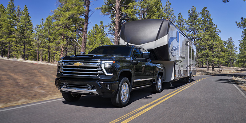 2026 Chevrolet Silverado HD towing an RV, showcasing its power and capability in Corpus Christi, TX.