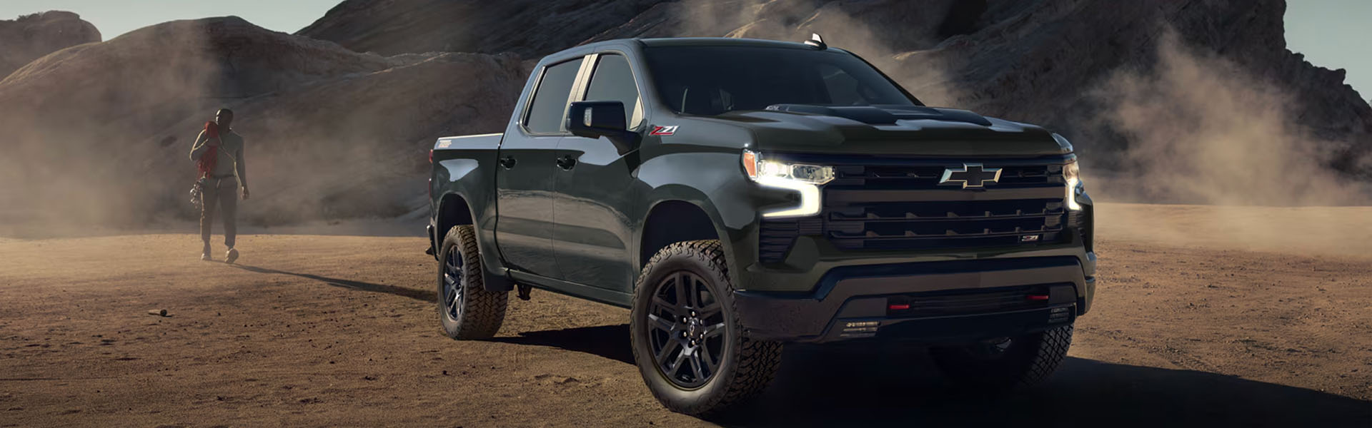 Dark green 2026 Chevrolet Silverado 1500 Z71 showcasing off-road capability in the desert.
